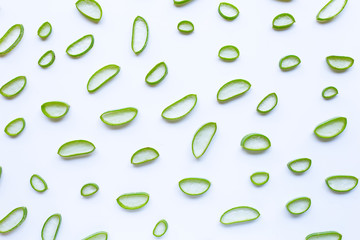 Aloe vera slices on white background.