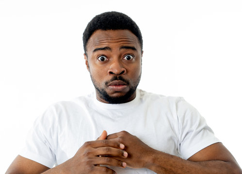 Close up portrait of concern scared shocked adult man with a terrified facial expression