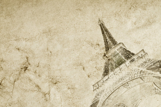 Old vintage paper texture background with the silhouette of the eiffel tower in Paris. High-quality photo texture of old vintage paper with scuffs, cracks and drops of spilled coffee.