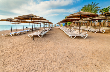 Morning at sandy beach of Eilat - famous tourist resort resort and recreational city in Israel. 