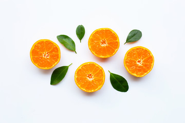 Orange fruits with  leaves on white background.