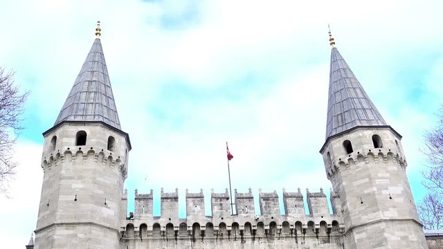 Entrance to the palace of the Sultan. Gates with towers and flag. Istanbul, Turkey.