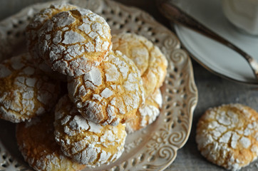 Crinkles almond cookies on a rustic plate