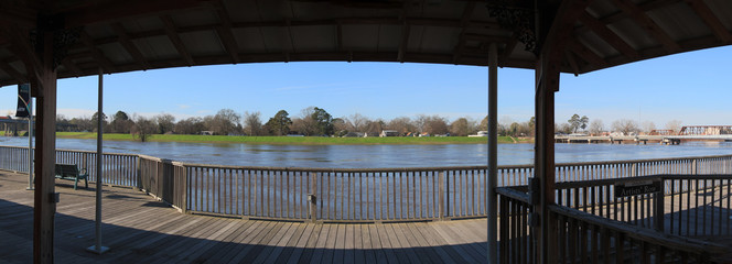 Under the Riverwalk at the Ouachita River flowing full at Monroe, La.