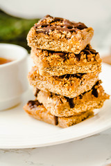Granola Bars, Healthy Homemade Snack, Superfood Bars with Cranberry, Pumpkin Seeds, Oats, Chia and Flax Seed on bright background, Vegan Meal.Close-up.Selective focus