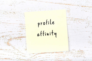 Yellow sticky note with handwritten text profile affinity