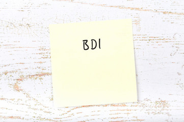 Yellow sticky note with handwritten text вdi