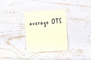 Yellow sticky note with handwritten text average ots