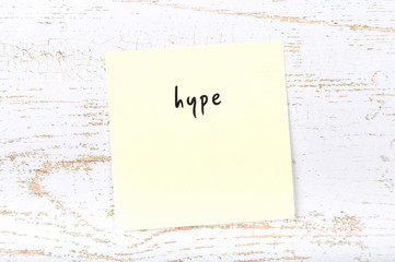 Yellow sticky note with handwritten text hype