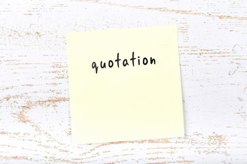 Yellow sticky note with handwritten text quotation