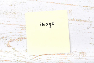 Yellow sticky note with handwritten text image