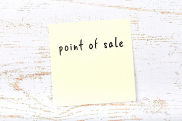 Yellow sticky note with handwritten text point of sale