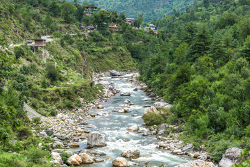 Fototapeta na wymiar Lush green beautiful Tirthan valley. This quiet valley is ideal for trekking, fishing, wildlife watching, and discovering under-explored hill villages.