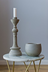 stone candlestick on the marble table