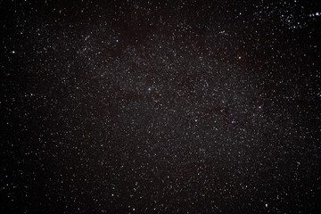  Milky Way. Space filled with stars in the sky.  Surrounded by the mountains.