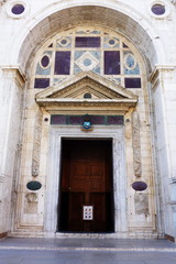 Fototapeta na wymiar Entrance door of Tempio Malatestiano, cathedral of Rimini, Emilia Romagna, Italy