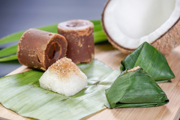 Pulut Inti. Savory glutinous rice with sweetened grated coconut wrapped in banana leaf. 