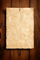 old paper advertisement on aged wood