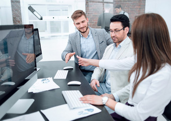 company employees discussing financial data