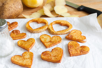 Preparing a food for Valentine's Day abstract love concept witch french fries chips heart shape