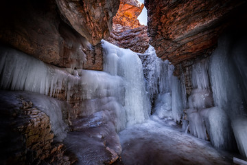 Frozen waterfall in a mountain gorge