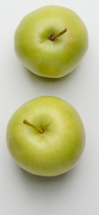 Two green apples on white