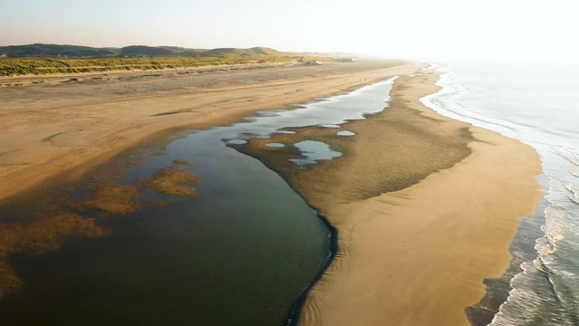 People walking on the beatch - Dutch coastline Hondsbossche seawall