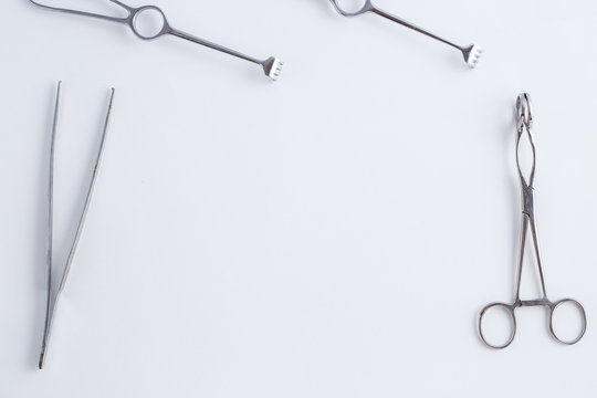 Concept for medicine. Vintage surgical instruments on white isolated background.
