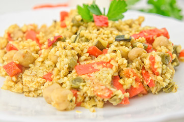 Cooked cous cous with vegetables closeup