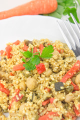 Cooked cous cous with vegetables closeup