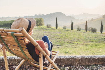 Enjoying life. Young woman looking at the valley in Italy, relaxation, vacations, lifestyle, summer fun concept. Vacations in Italy