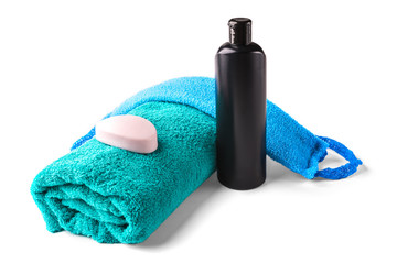 Towel, shampoo and soap isolated on white background.