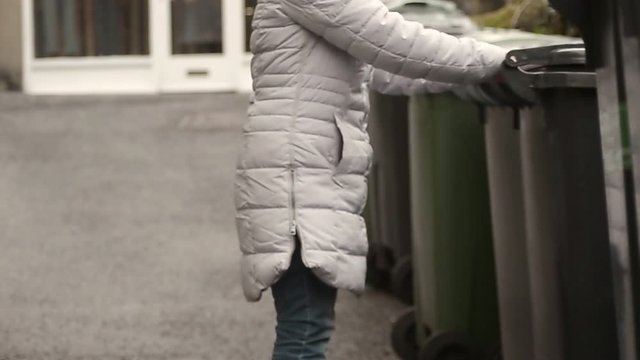 Emptying the wheelie bin