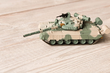 Toy model of the Soviet tank on a wooden table.