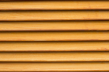 Light orange wall of the house lined with wooden. orange paint for design, texture pattern, nature pattern, wood orange.