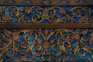A nicely decorated with semi precious stones minerals labradorite, moonstone fragment of the front side of Thai temple , Chiang Mai
