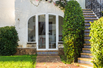 Fototapeta na wymiar Beautiful exterior of newly built luxury home. Yard with green grass and walkway