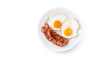 Fried eggs and bacon for breakfast isolated on white background. Top view. Copyspace