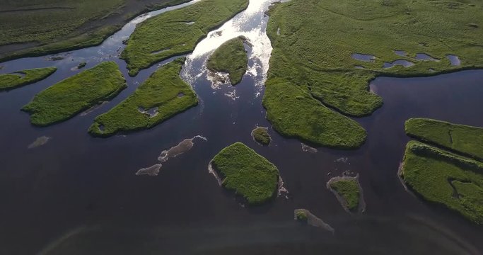 Aerial Footage of Green Islands on a River Delt by During Sunny Summer In Snaefellsness Peninsula, Iceland
