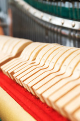 Close-up view of hammers and strings inside the piano.