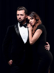 fashion studio photo of beautiful couple in elegant clothes