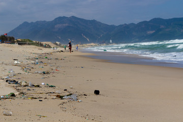 Beach pollution, plastic and waste from ocean on the beach