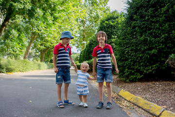 Siblings in park, having fun, playing together