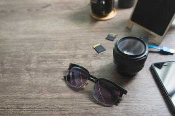 Photography accessories on wooden table, Lifestyle concept, Close-up lens, Copy space.