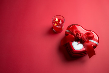 Heart shaped gift box on Red background for Valentine`s Day, Copy Space.