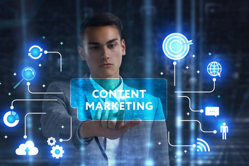 The concept of business, technology, the Internet and the network. A young entrepreneur working on a virtual screen of the future and sees the inscription: Content marketing