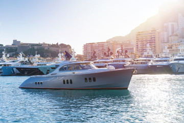 Boat in Monaco harbour  with Monaco landscape on a background