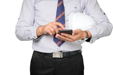 Architect or builder is using smartphone and holding helmet on white background.