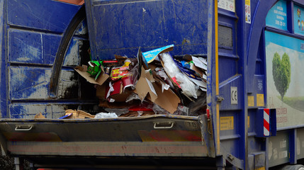 garbage truck collects papers