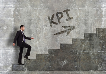 Business, technology, internet and networking concept. A young entrepreneur goes up the career ladder: KPI
